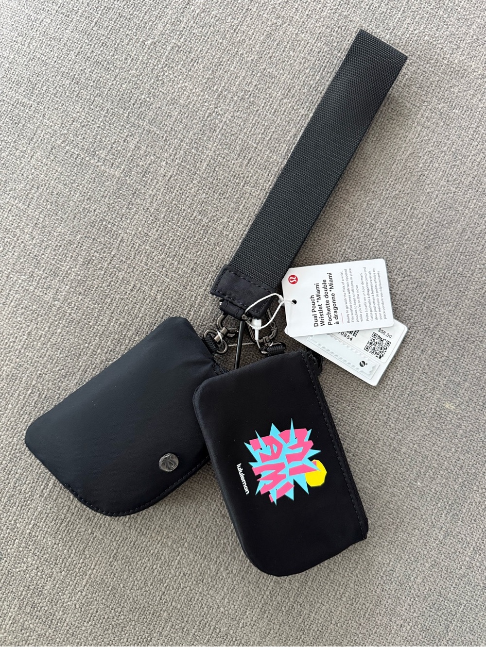 lululemon athletica Black Wristlet with Colorful Graphic Accent